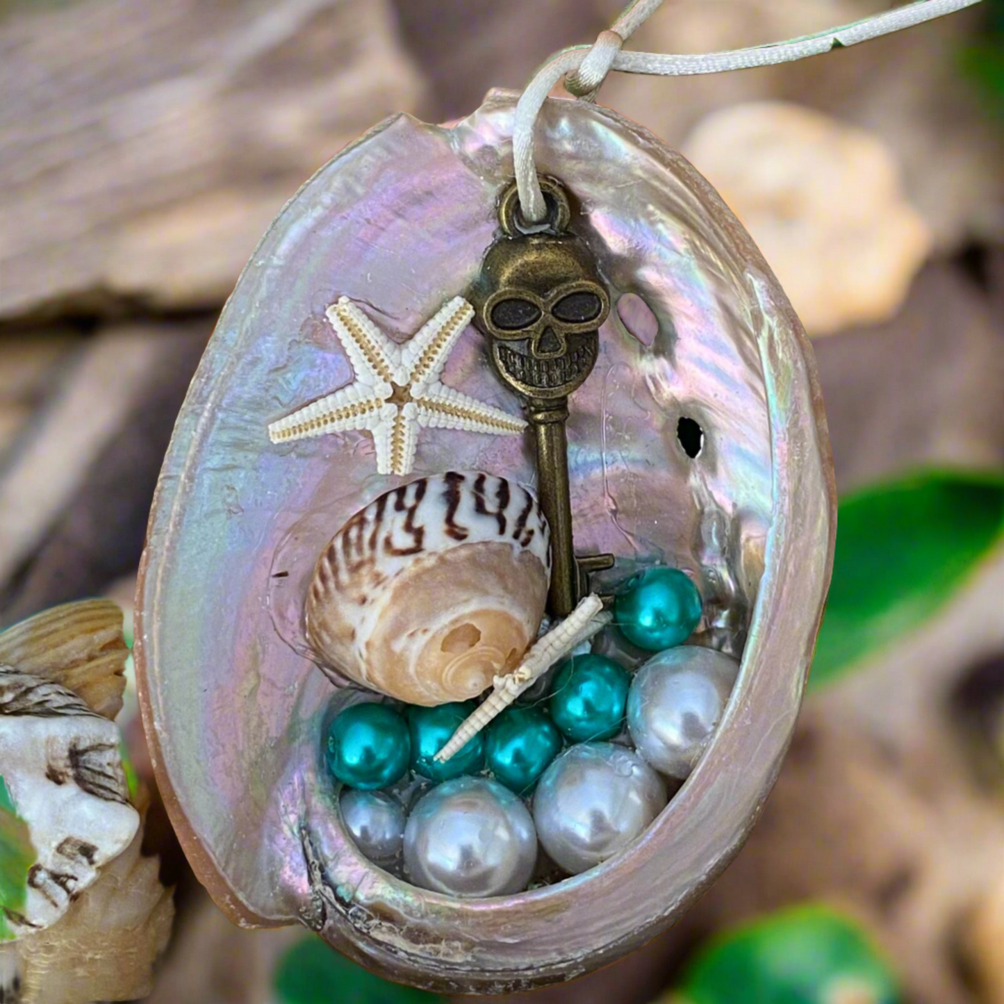 Abalone Shell Ornament with skull, beads and shells